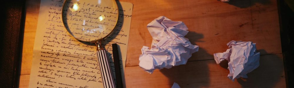 Close-up of legal case files and gavel on mahogany desk for criminal defense investigation services
